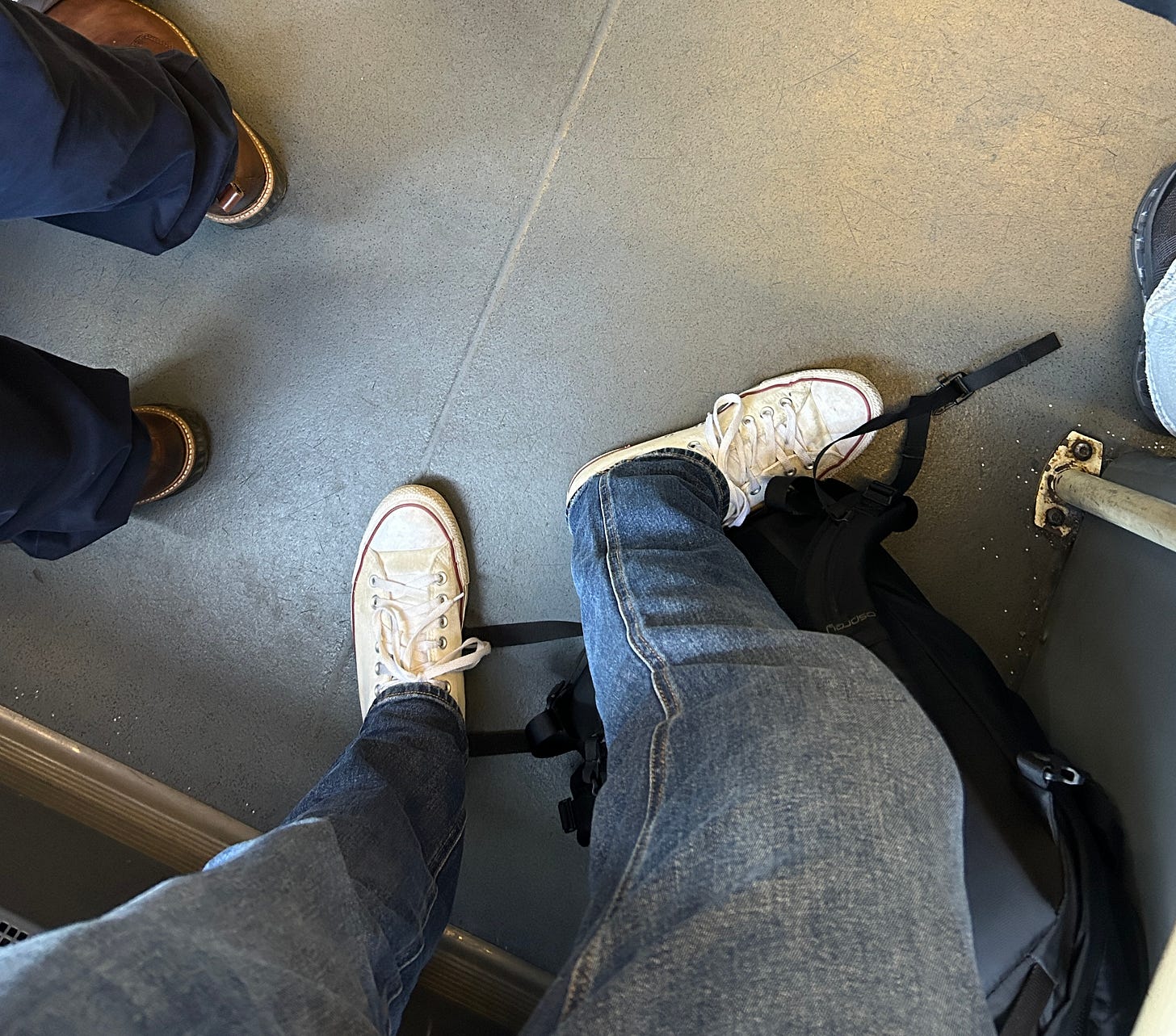 A photo of my shoes on the bus