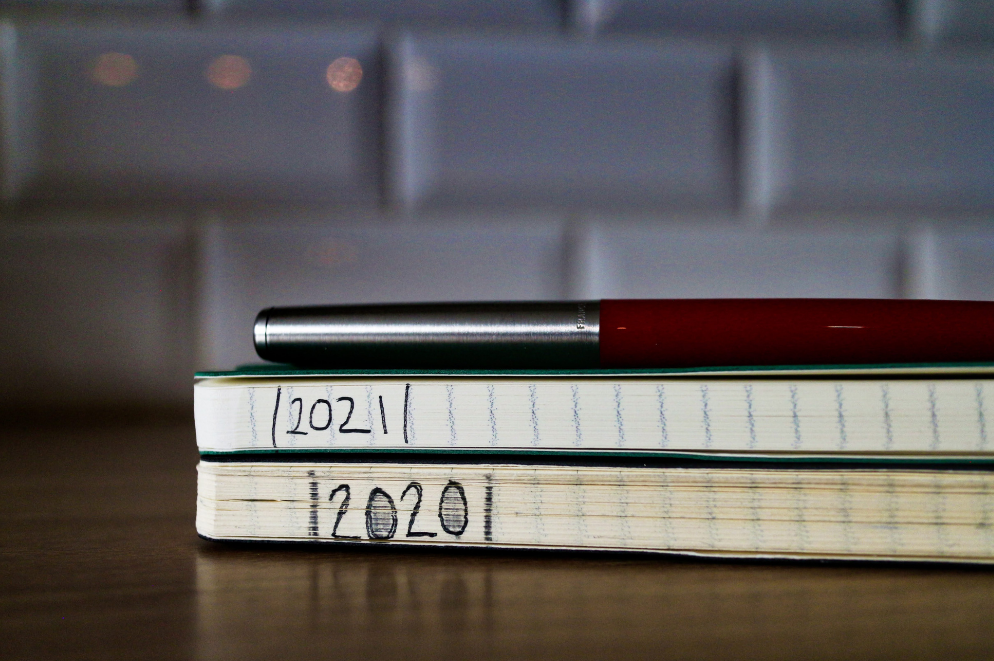 A photo of two moleskine notebooks